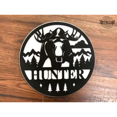 Circular moose-themed wall decoration on personalized round signs with outdoor theme wildlife design