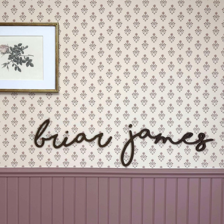 Decorative wall with framed pictures and &