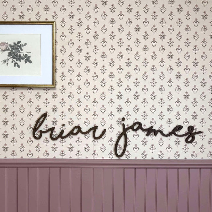 Decorative wall with framed pictures and &