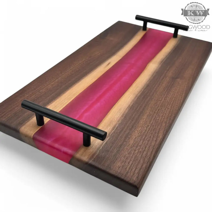 Epoxy charcuterie board with black metal handles and walnut