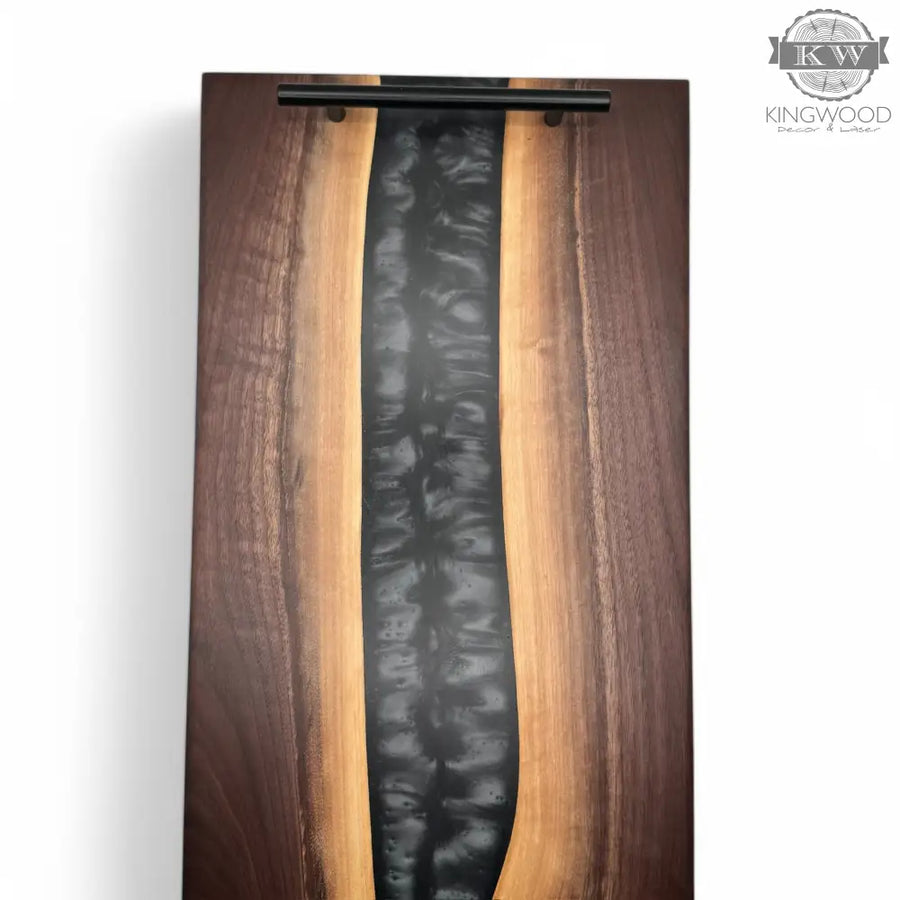 Epoxy charcuterie board with black metal handles in walnut