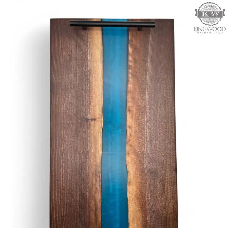 Epoxy charcuterie board with black metal handles in walnut