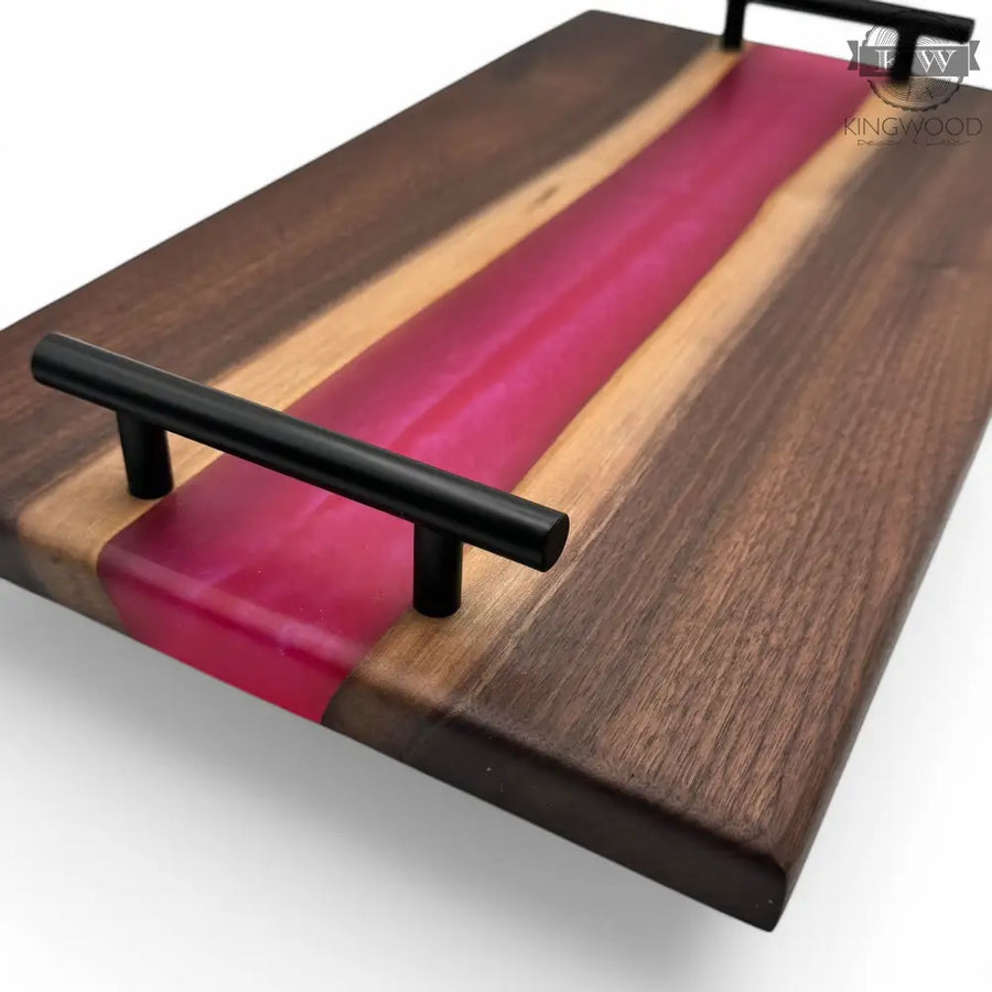 Epoxy charcuterie board with black metal handles and walnut