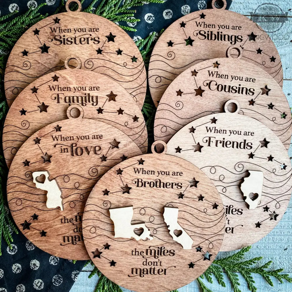 Wooden relationship-themed ornaments illustrating matter togetherness for the togetherness ornament collection
