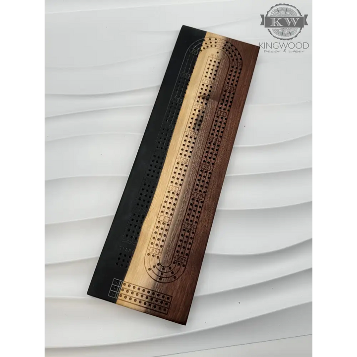 Handcrafted live edge walnut cribbage board with epoxy