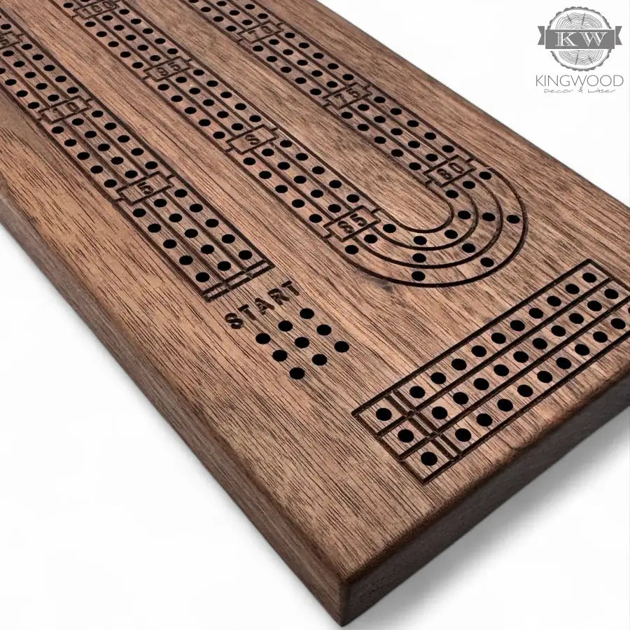 Handcrafted walnut cribbage board with metal pegs