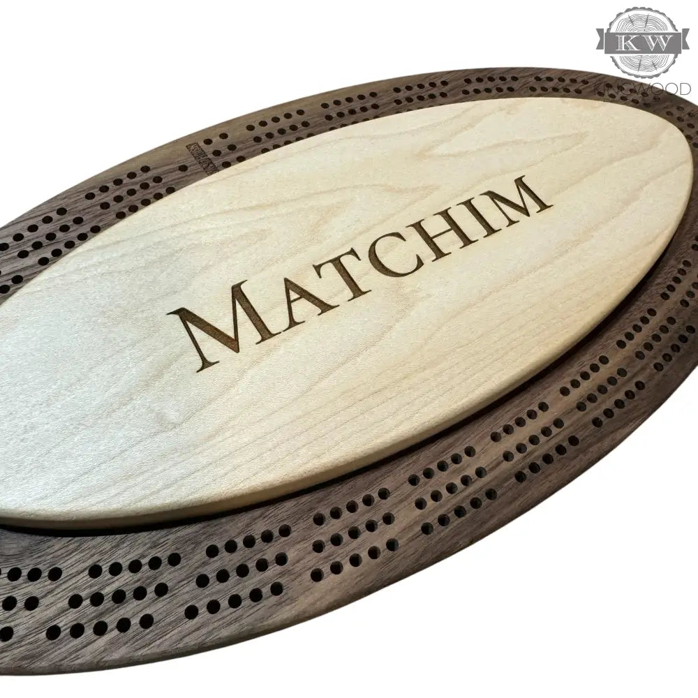 Handcrafted walnut cribbage board with metal pegs