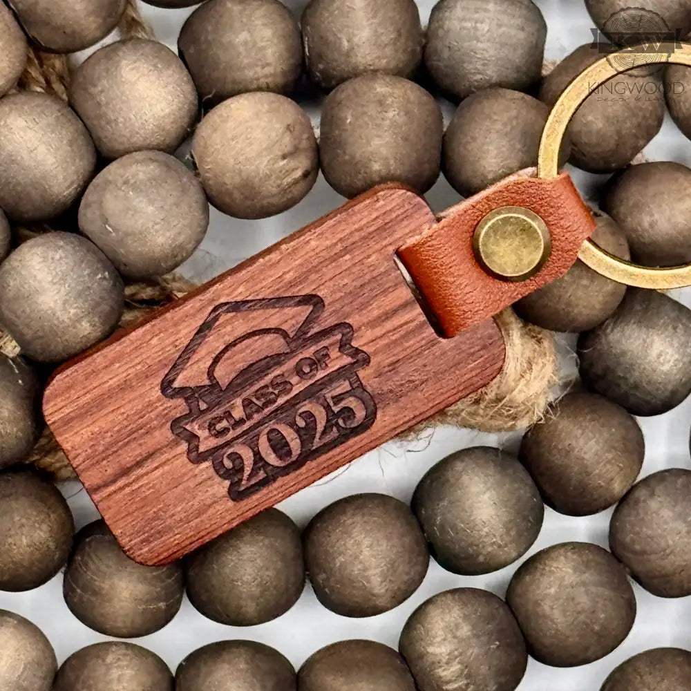 Handcrafted wooden keychain with leather loop and engraving, ideal for decor or wooden keychains
