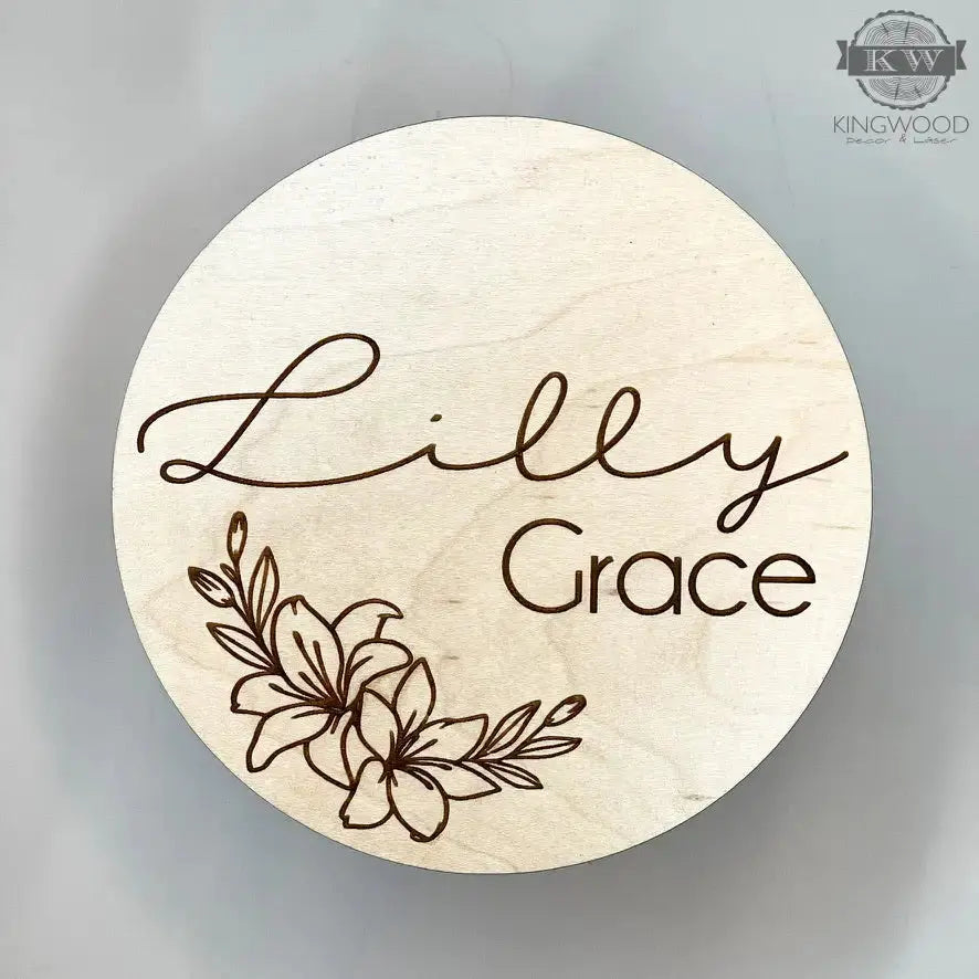 Engraved wooden circle with floral design on natural birchwood showcasing unique grain