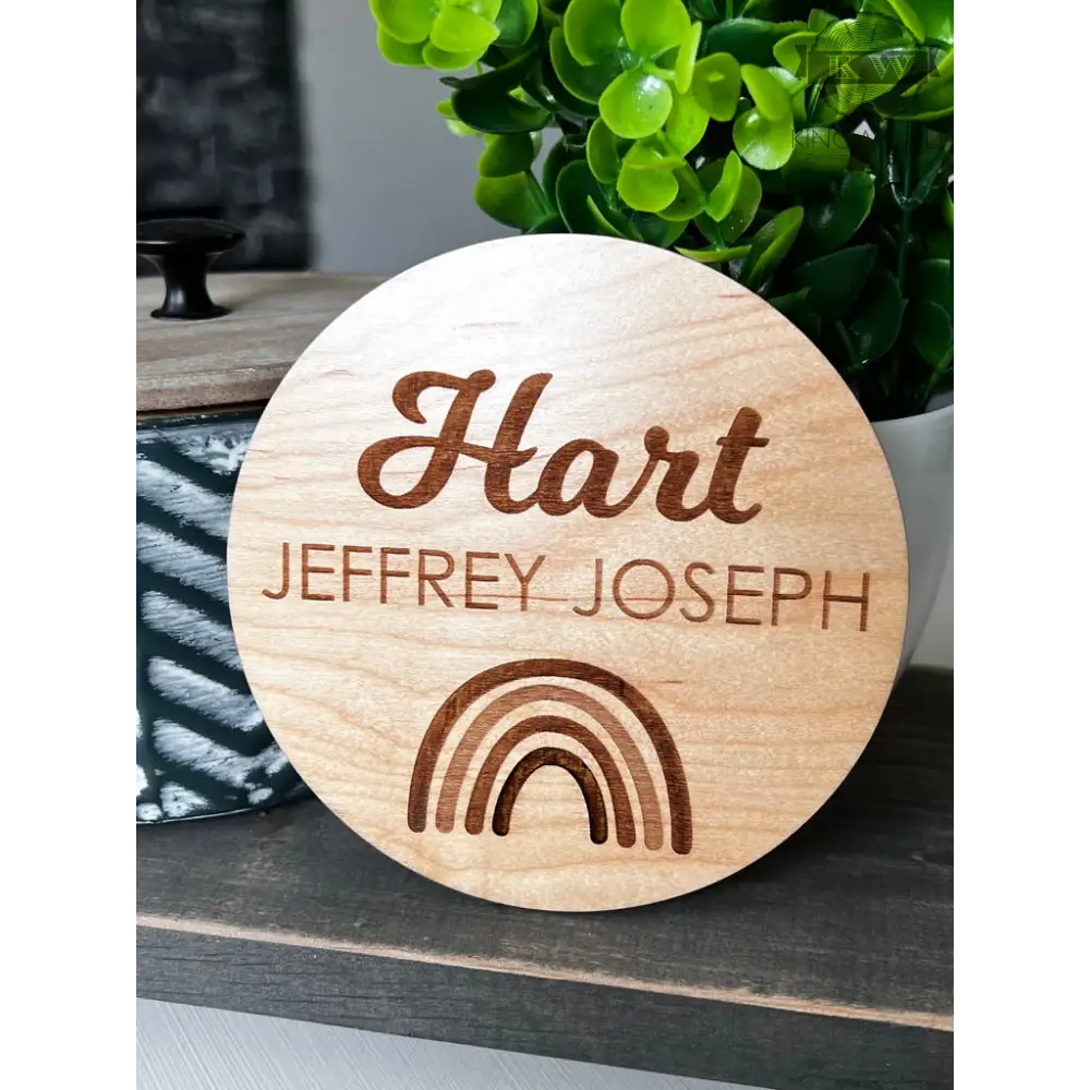Engraved wooden name plaque on natural birchwood with unique grain, ideal for cutting boards