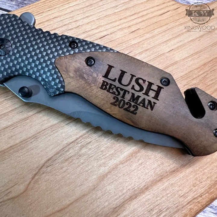 Engraved folding pocket tool with wooden handle and stainless steel blade
