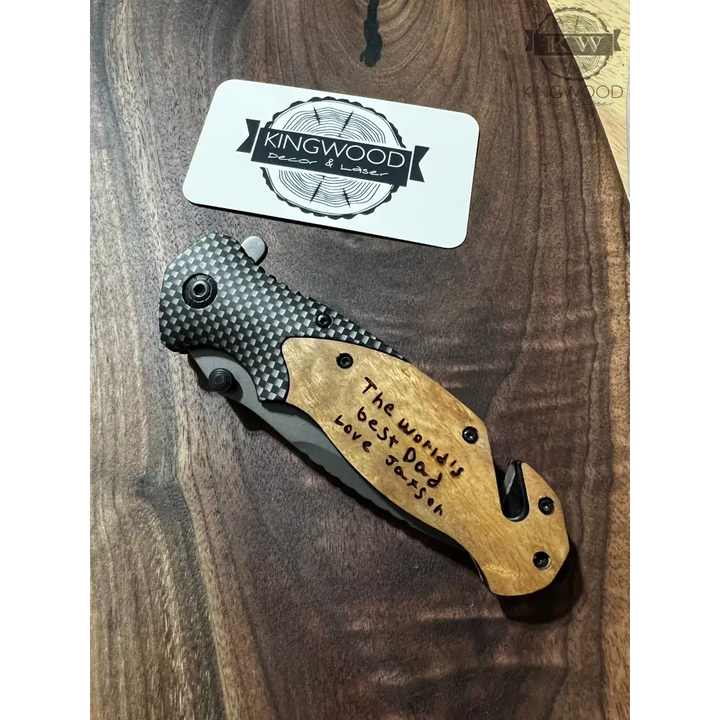 Engraved folding pocket tool with wooden handle and stainless steel blade