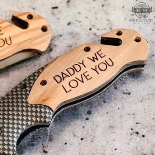 Engraved wooden-handled folding pocket tool with stainless steel blade for everyday carry