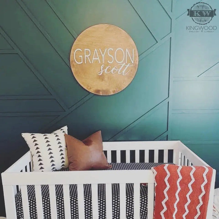 Rustic baby nursery round with crib pillows and blanket for personalized decor