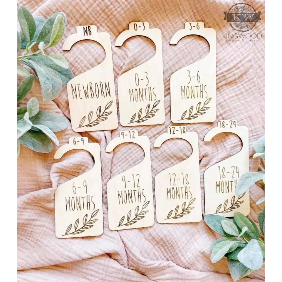 Custom engraved wooden baby clothes hanger with cloth dividers for nursery closet organization