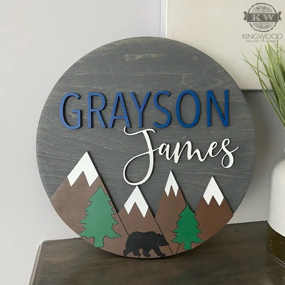 Round wooden nursery decor sign with mountain and bear design for Fort Mcmurray