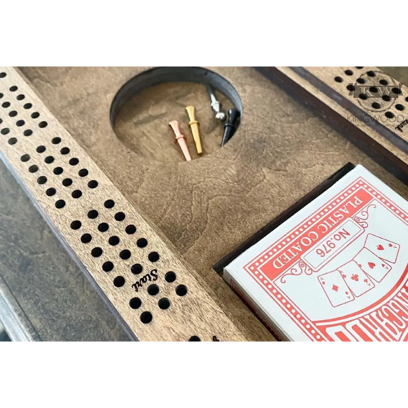 Cribbage board and metal pegs with storage compartment