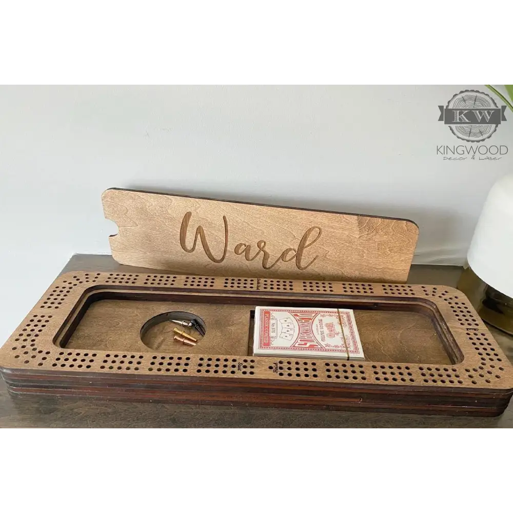 Personalized Baltic Birch cribbage board with storage compartment and metal pegs for gameplay