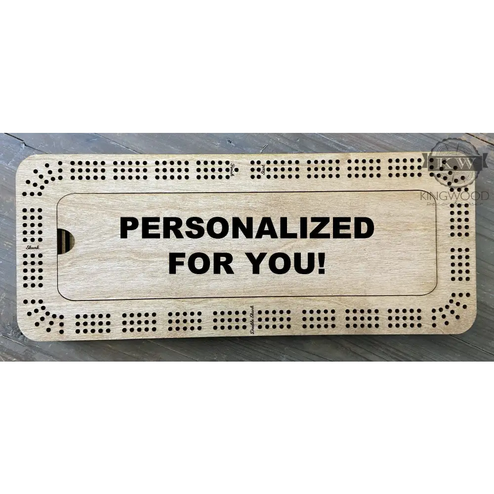 Personalized wooden cribbage board with storage compartment and metal pegs for game play