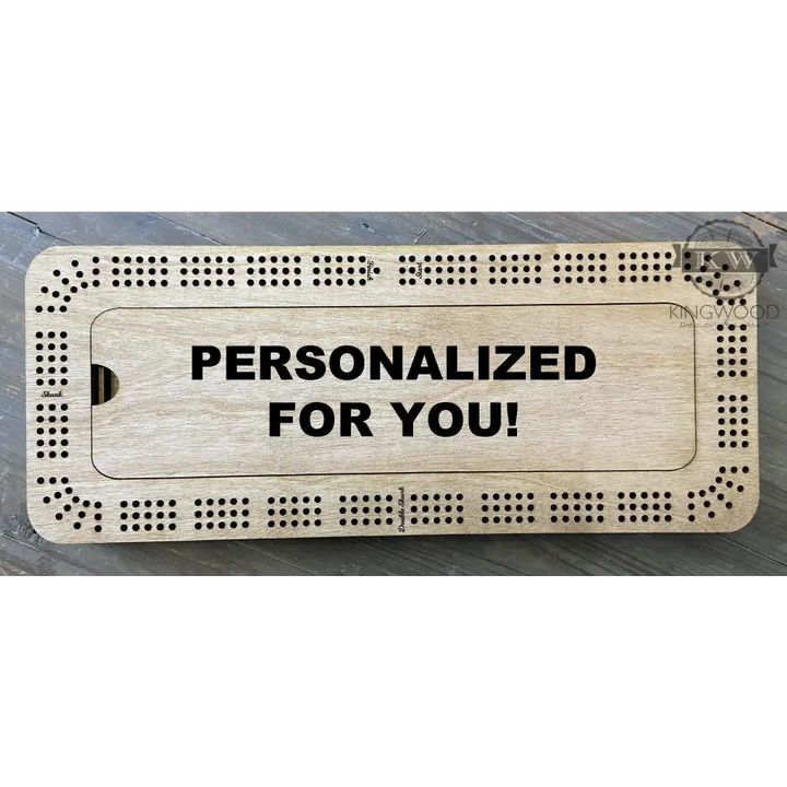 Personalized wooden cribbage board with storage compartment and metal pegs for game play