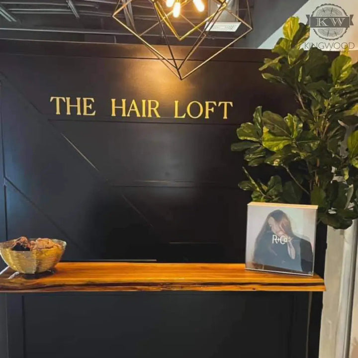 Laser cut decor featuring a hair salon reception area with a stylish name sign