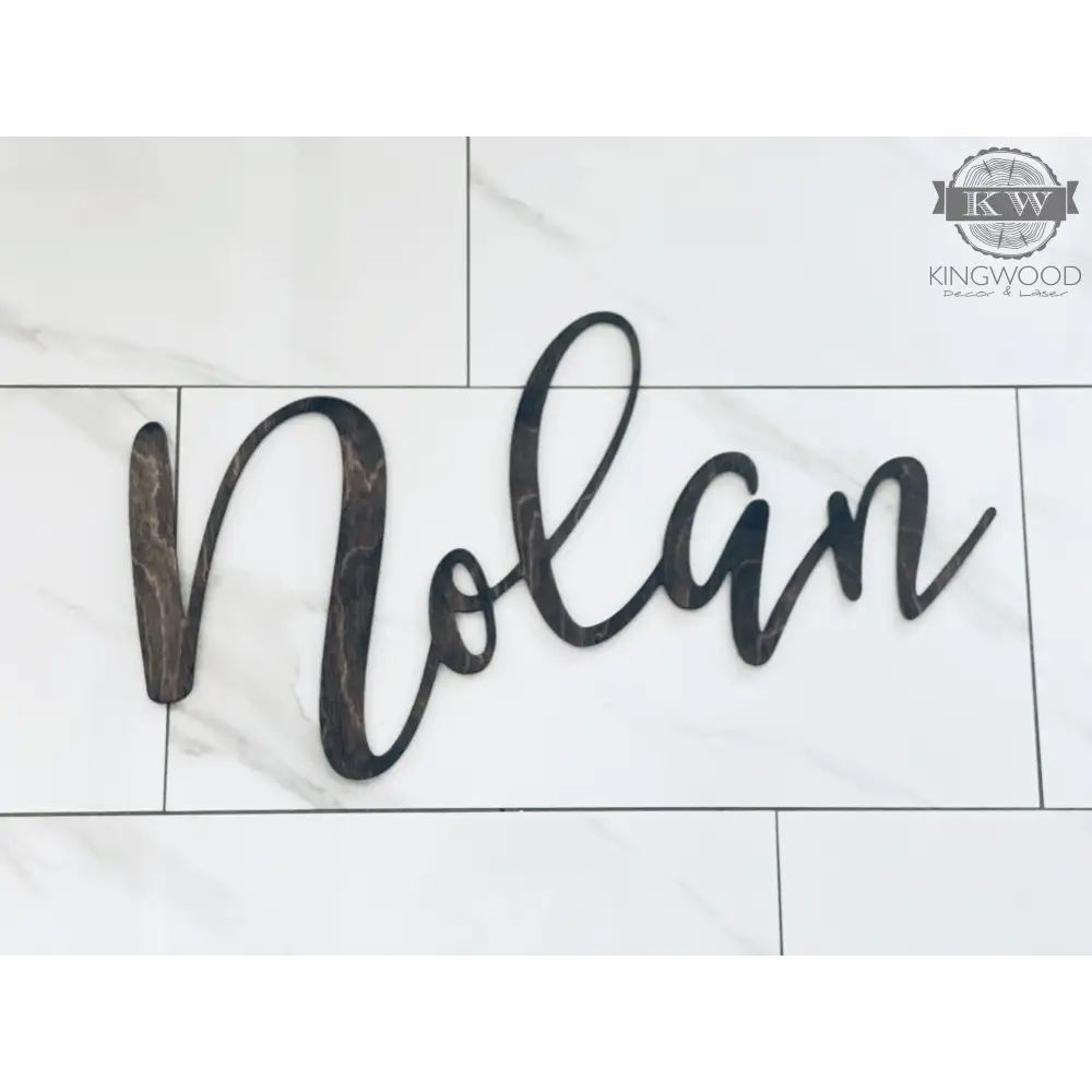 Dark wooden laser cut name sign for home decor, ideal for personalized cutting boards