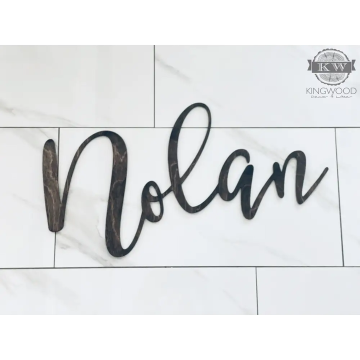 Dark wooden laser cut name sign for home decor, ideal for personalized cutting boards