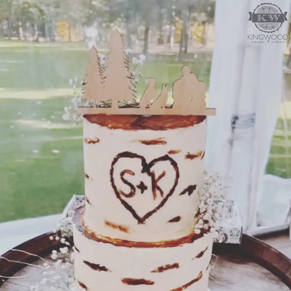 Two-tiered birch-bark-themed wedding cake with custom cake topper and digital proof