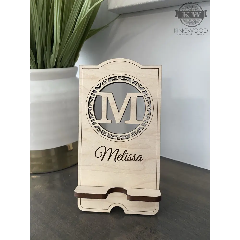 Personalized wooden cell phone stand with engraved name, perfect for a wooden cell display
