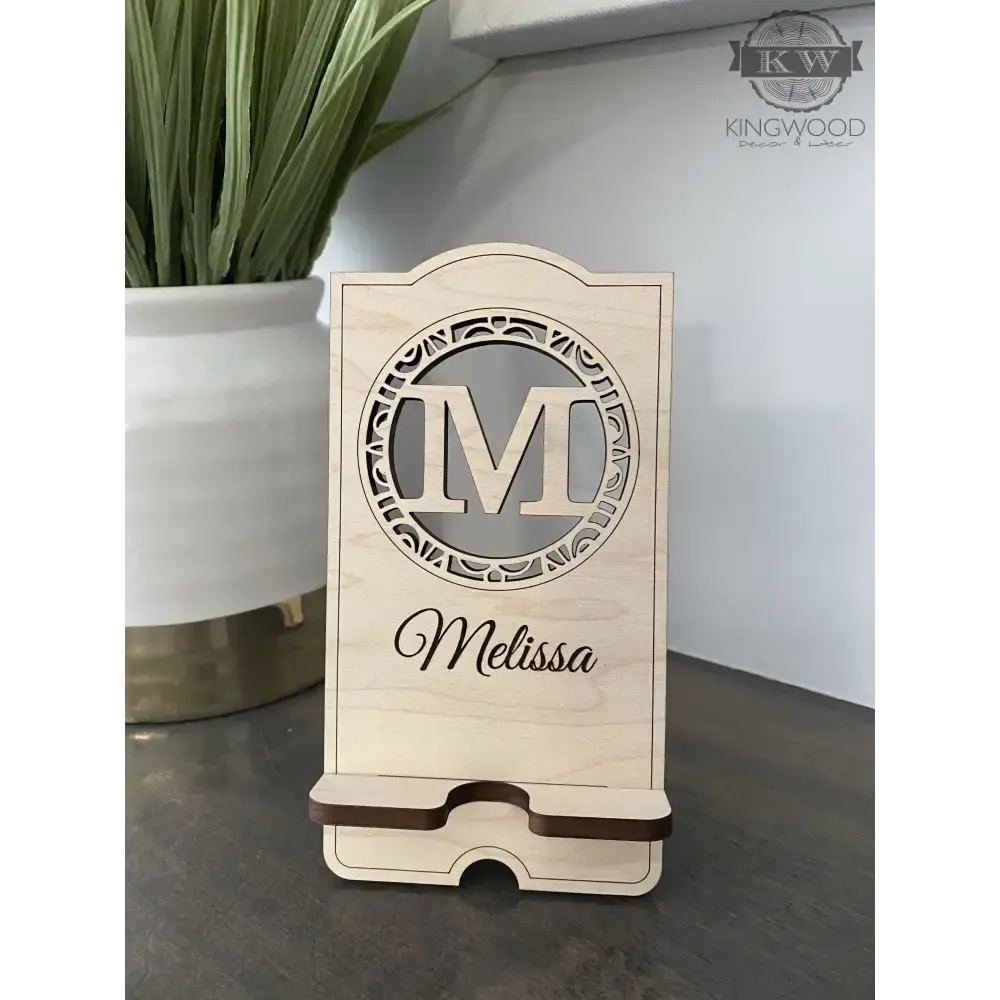 Personalized wooden cell phone stand with engraved name, perfect for a wooden cell display