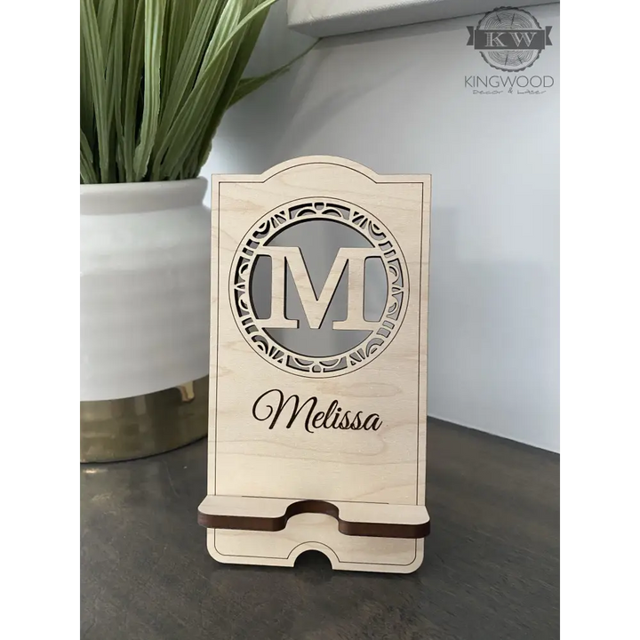 Personalized wooden cell phone stand with engraved name, perfect for a wooden cell display