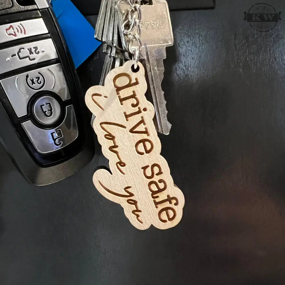 Car key with wooden keychain featuring drive safe and I love you engraving, perfect gift