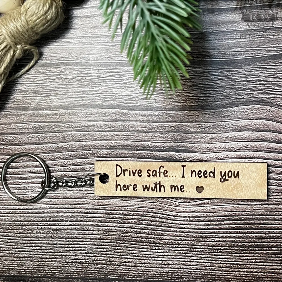Engraved wooden keychain with Drive Safe message, ideal for decor or gift use