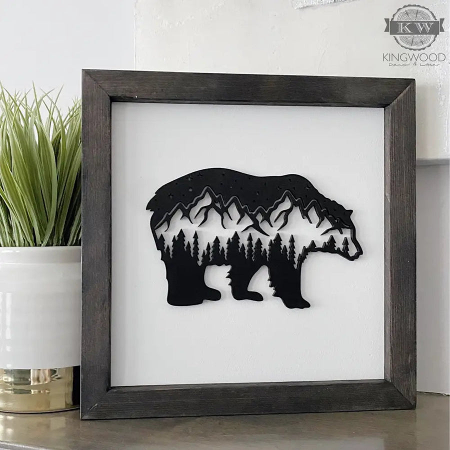 Laser cut framed bear silhouette art displayed on a wooden sign suitable for decor