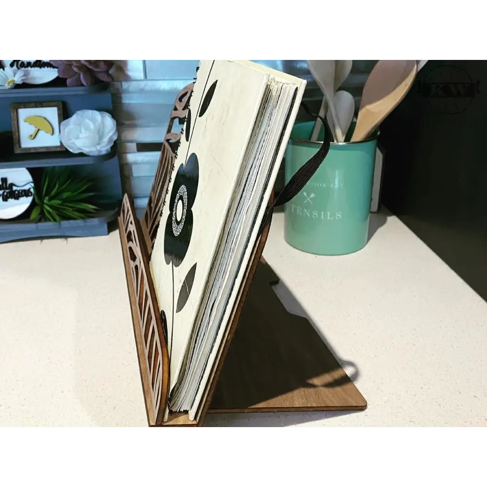 Wooden homestyle book stand with floral book and monogram engraving, ideal recipe holder