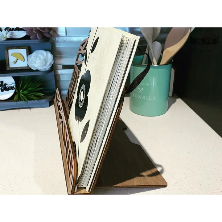 Wooden homestyle book stand with floral book and monogram engraving, ideal recipe holder