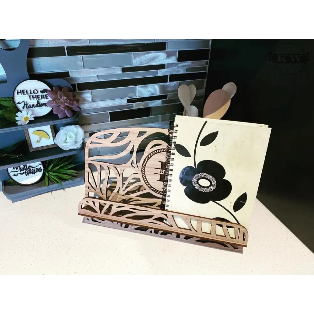 Laser-cut wooden homestyle book stand with notebook, ideal as a recipe stand or cutting board holder