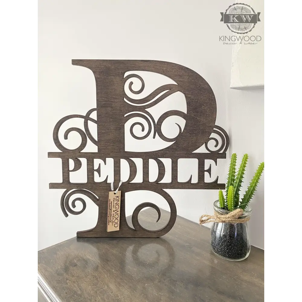 Large family monogram signs displayed as personalized wooden wall decoration