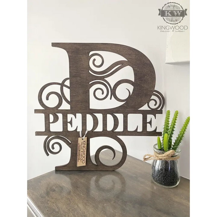 Large family monogram signs displayed as personalized wooden wall decoration