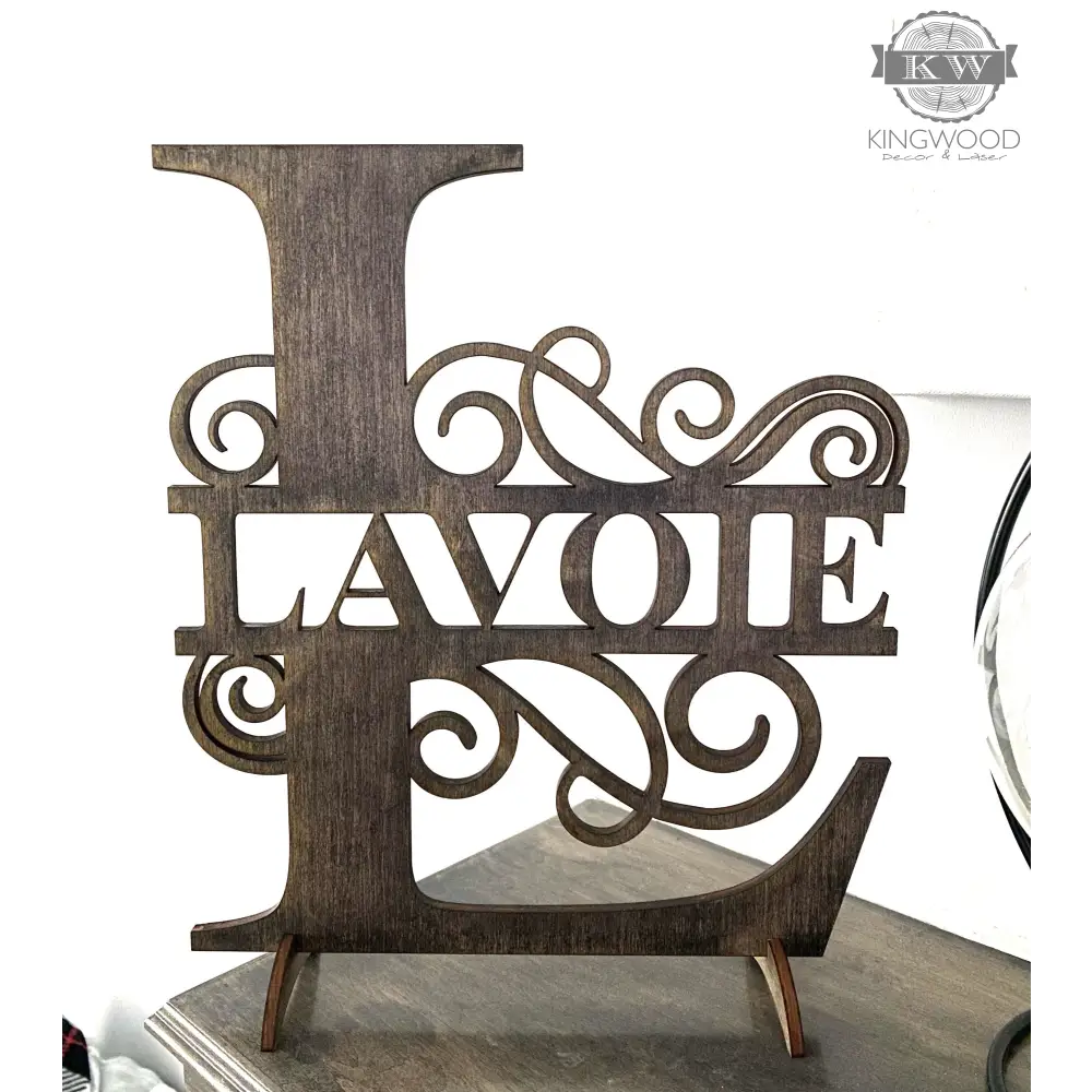 Large family monogram sign featuring decorative wooden letter L with flourishes for personalized decor