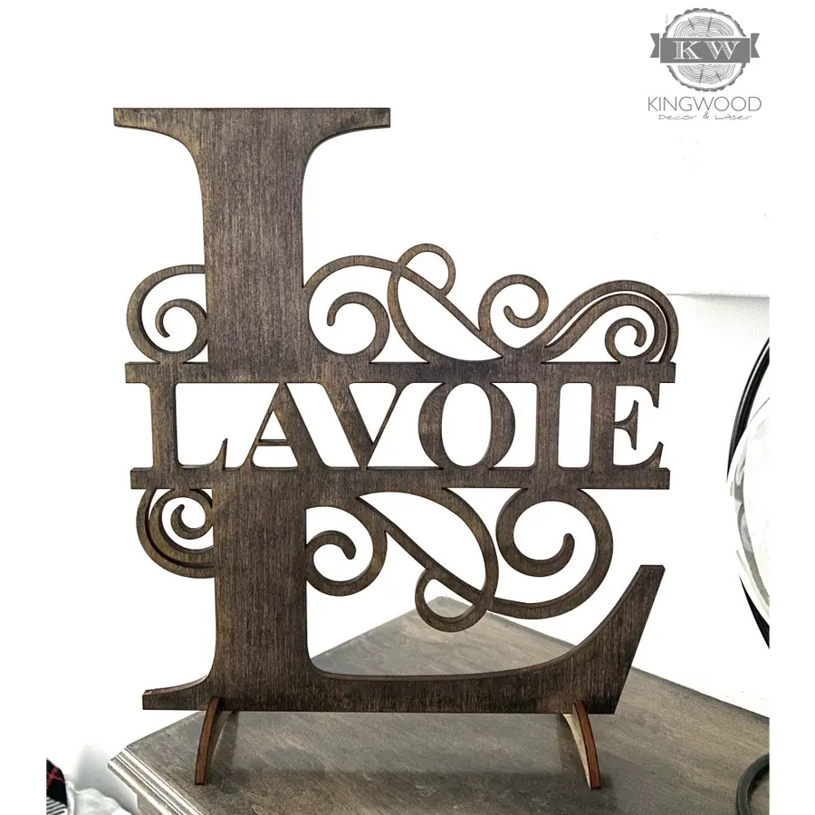 Large family monogram sign featuring decorative wooden letter L with flourishes for personalized decor