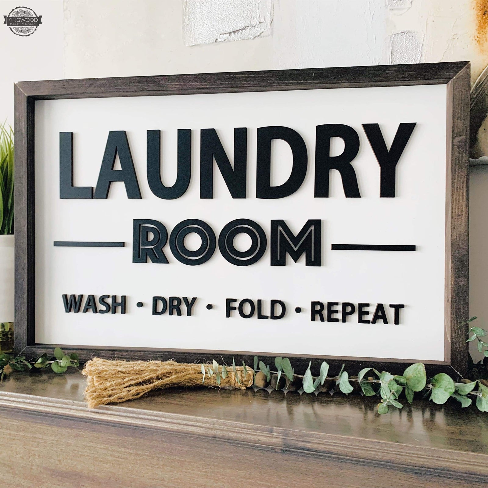 Framed laundry room sign featuring laser cut words for rustic home decor