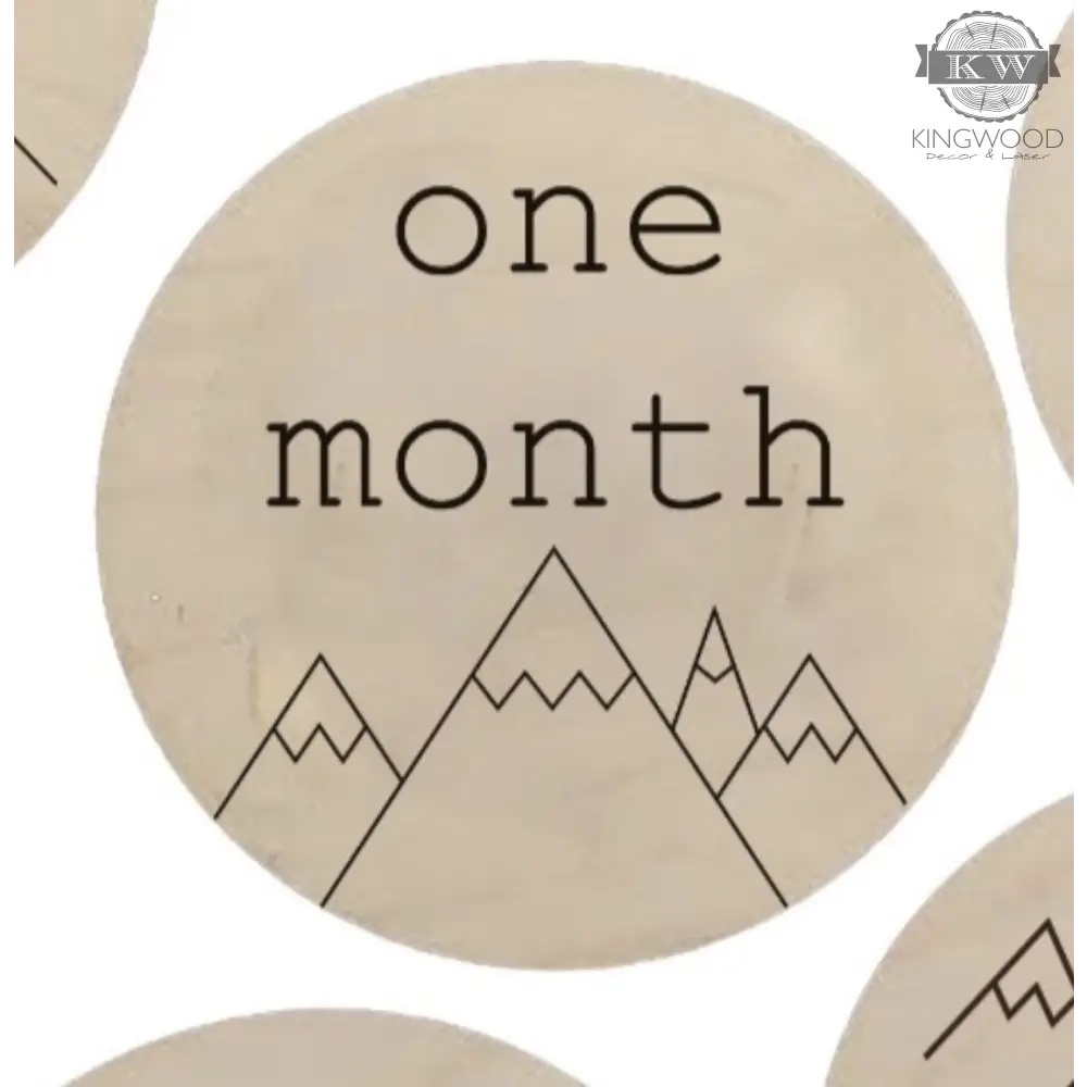 Wooden milestone disc from baby’s monthly milestones set with mountain design