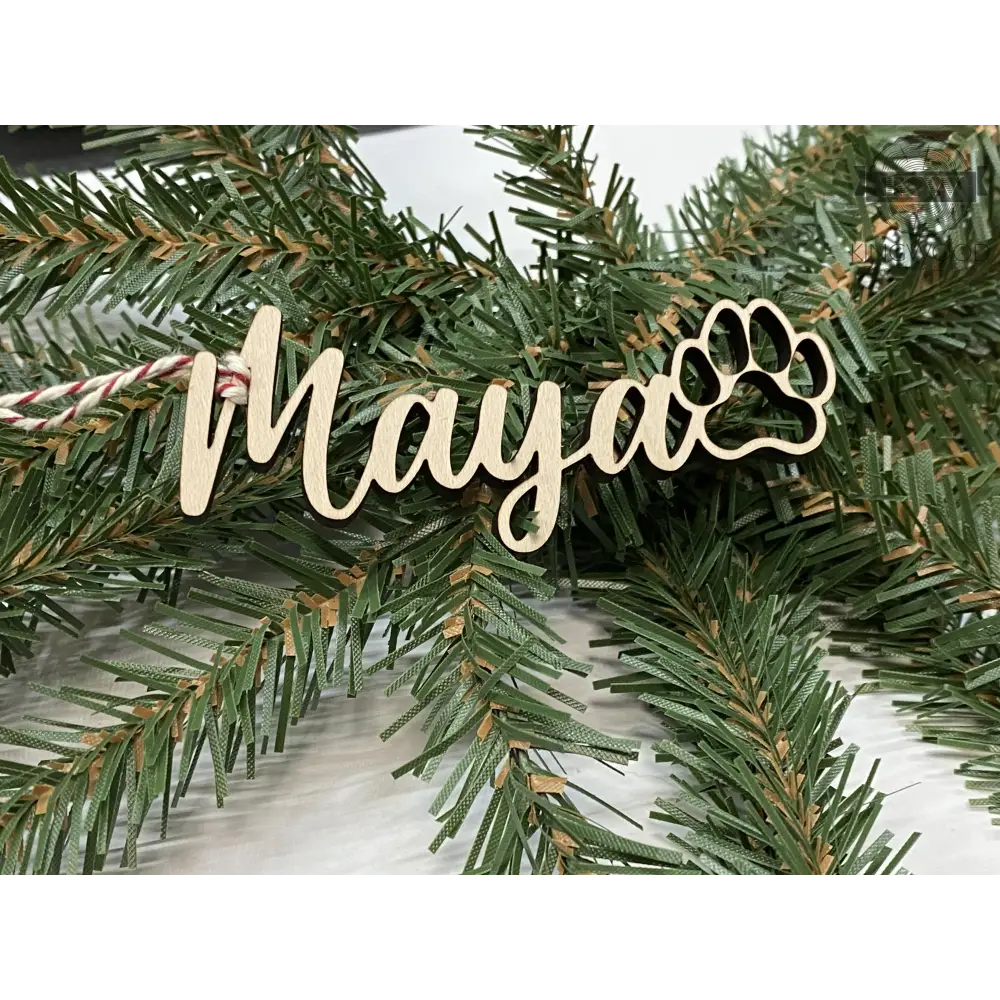 Personalized Christmas decor name ornament with paw print, perfect for Fort McMurray homes