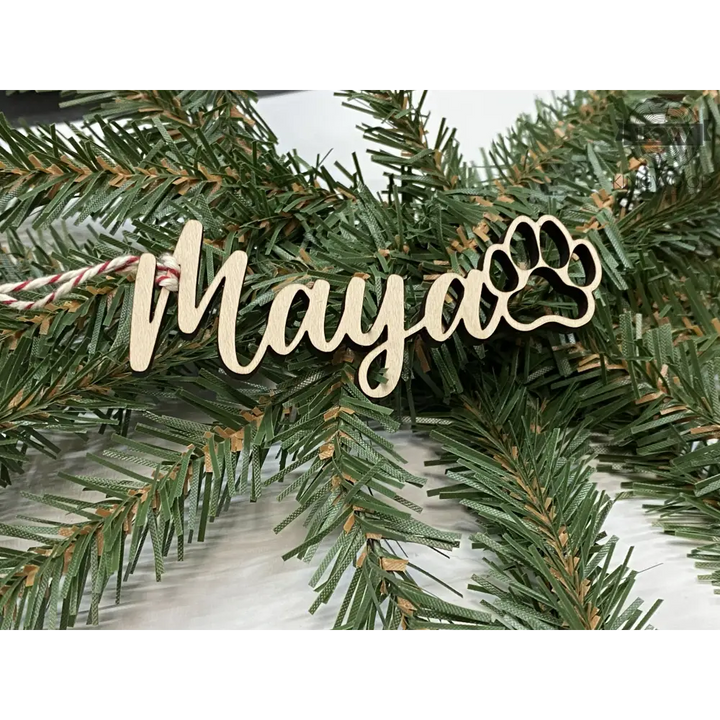 Personalized Christmas decor name ornament with paw print, perfect for Fort McMurray homes