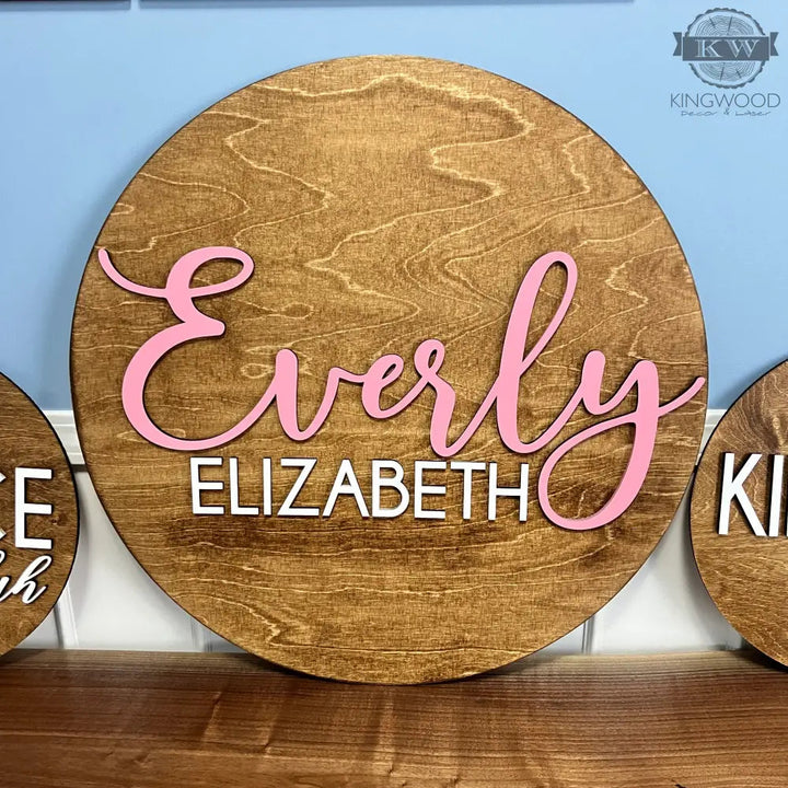 Personalized rustic baby nursery round sign for decor in a rustic baby nursery setting