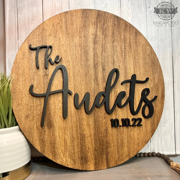 Round wooden sign with black lettering for wedding guest signing and sign guestbook