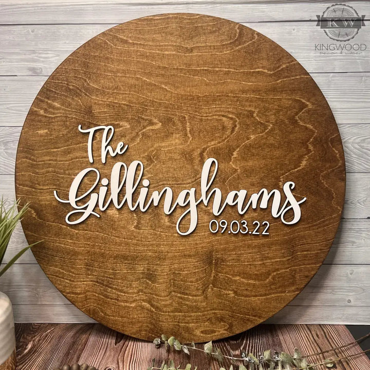 Round wooden sign for wedding guest signing and guestbook at the event