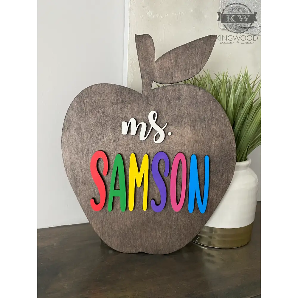 Wooden Apple teacher sign with laser-cut letters, ideal for decor and cutting boards
