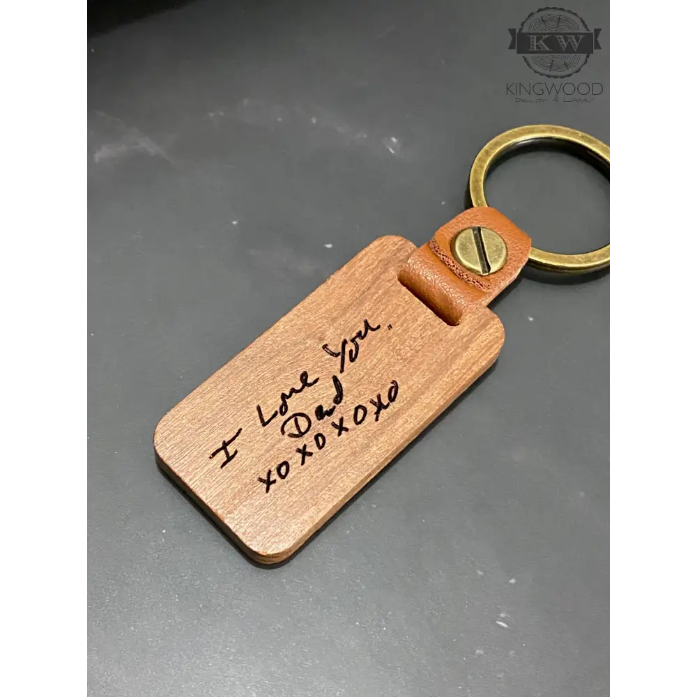 Engraved wooden keychain with custom handwritten design and leather detail for personalized wooden keychains
